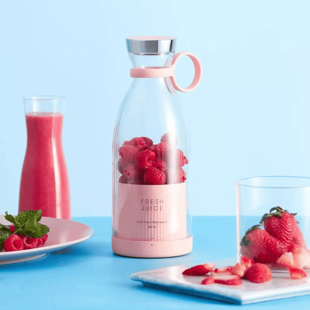 Presse agrume design Fresh Juice portable avec moteur électrique intégré.