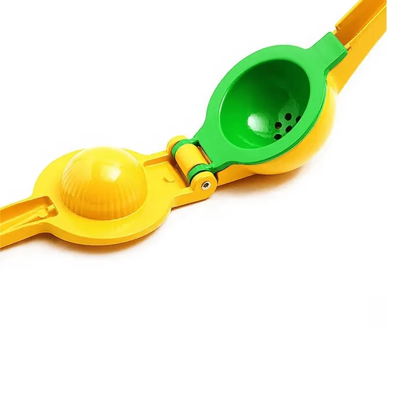 Presse citron compact manuel avec système de compression ergonomique.